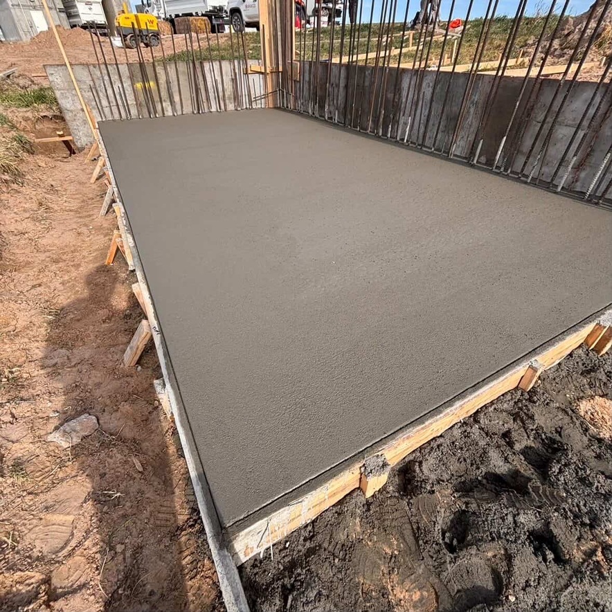 Photo: concrete work in progress, finished driveway or sidewalk