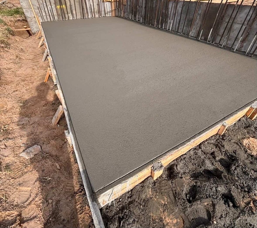 Photo: concrete work in progress, finished driveway or sidewalk